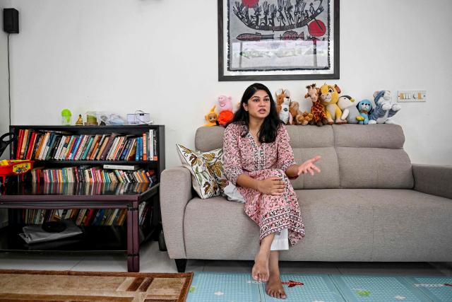 This photograph taken on October 2, 2025 shows Roli Shrivastava speaking during an interview with AFP at her residence in New Delhi. Pollution levels in India's capital city Delhi is shaping decisions on parenthood -- forcing a small yet growing number of people to flee because of the health hazards associated with toxic air. Home to more than 30 million people, New Delhi and the surrounding metropolitan area consistently tops world rankings for air pollution. (Photo by Sajjad HUSSAIN / AFP) / TO GO WITH 'India-Environment-Pollution-Health' FOCUS