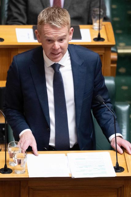 Leader of the Labour opposition Chris Hipkins speaks in the house about former New Zealand prime minister Jim Bolger after his death, at Parliament in Wellington on October 16, 2025. (Photo by Marty MELVILLE / AFP)