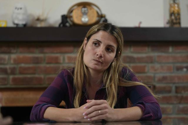 Agricultural producer Aldana Guanzini, 37, gestures during an interview with AFP at her home in the rural town of San Andres de Giles in Buenos Aires province, Argentina on September 24, 2025. Surrounded by wheat fields and dozing during siesta time, the farming town of San Andres de Giles voted for Javier Milei in 2023. Two years later, the enthusiasm has faded into disappointment and uncertainty, ahead of a crucial legislative election for the Argentine president. (Photo by JUAN MABROMATA / AFP)