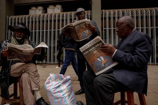 Men read newspapers with headlines of Kenyan opposition leader Raila Odinga in Nairobi on October 16, 2025 following his death at the age of 80 during a health visit to India. Kenyan opposition leader Raila Odinga has died at the age of 80 during a health visit to India, local police said on October 15, 2025.
Odinga was the perennial opposition figure of Kenyan politics, running unsuccessfully for the presidency on five occasions, most recently in 2022. 
He remained a dominant force, able to rally huge numbers, particularly from his native western Kenya. (Photo by SIMON MAINA / AFP)