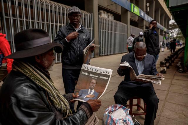 Men read newspapers with headlines of Kenyan opposition leader Raila Odinga in Nairobi on October 16, 2025 following his death at the age of 80 during a health visit to India. Kenyan opposition leader Raila Odinga has died at the age of 80 during a health visit to India, local police said on October 15, 2025.
Odinga was the perennial opposition figure of Kenyan politics, running unsuccessfully for the presidency on five occasions, most recently in 2022. 
He remained a dominant force, able to rally huge numbers, particularly from his native western Kenya. (Photo by SIMON MAINA / AFP)