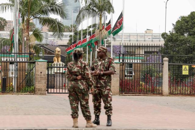 Kenyan administrative officers stand in front of Kenyan flags flying half mast in Nairobi on October 16, 2025  following the death of Kenyan opposition leader Raila Odinga at the age of 80 during a health visit to India. Kenyan opposition leader Raila Odinga has died at the age of 80 during a health visit to India, local police said on October 15, 2025.
Odinga was the perennial opposition figure of Kenyan politics, running unsuccessfully for the presidency on five occasions, most recently in 2022. 
He remained a dominant force, able to rally huge numbers, particularly from his native western Kenya. (Photo by SIMON MAINA / AFP)