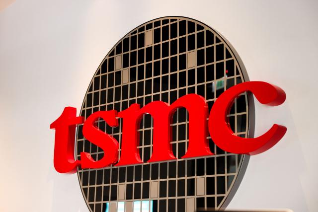 (FILES) The logo of Taiwan Semiconductor Manufacturing Company (TSMC) is seen at its headquarters in Hsinchu on November 21, 2024. Taiwanese tech titan TSMC reported on October 16, 2025 a forecast-busting net profit for the third quarter on skyrocketing demand for semiconductor chips used to power iPhones and artificial intelligence. (Photo by I-Hwa CHENG / AFP)