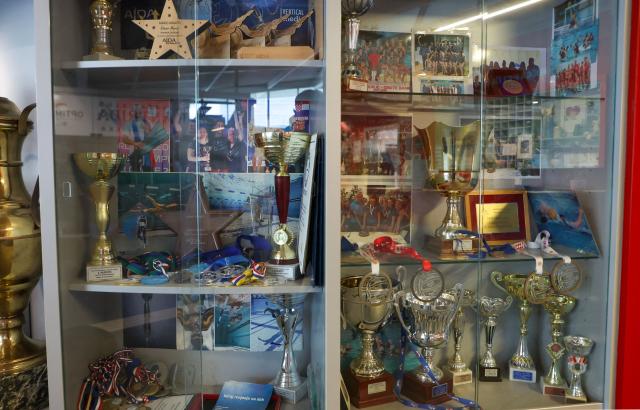 This photograph shows a glass cabinet displaying awards and certificates winning by Croatian freediver Vitomir Maricic, 40, during competitions at the pool in Rijeka, on October 14, 2025. Croatian freediver Vitomir Maricic went beyond what seemed impossible for the human body by holding his breath for an astonishing 29 minutes and three seconds under water. (Photo by DAMIR SENCAR / AFP)