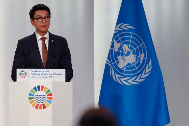 (FILES) Madagascar's President Andry Rajoelina delivers remarks during the opening session of the third United Nations Oceans Conference (UNOC3) in the French Riviera city of Nice on June 9, 2025. Madagascar's ousted president confirmed for the first time that he had fled the country, issuing a statement after a military-led power grab prompted by weeks of demonstrations that have plunged the island nation into crisis.
President Andry Rajoelina left between October 11 and 12 after "explicit and extremely serious threats were made against the life of the Head of State," the presidency said in a statement late Wednesday. (Photo by Ludovic MARIN / AFP)