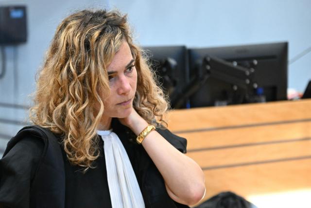 Emmanuelle Franck, one of the lawyers for defendant Cedric Jubillar, waits for the opening of the trial of Cedric Jubillar, accused of the disappearance of Delphine Jubillar, in the courtroom of the Tarn Assize Courthouse in Albi, southwestern France, on October 16, 2025. Cedric Jubillar, a 38-year-old construction worker accused of causing the disappearance of his wife Delphine, who wanted to leave him, on the night of December 15-16, 2020, appears before the Tarn Assize Court from September 22 to October 17. Since the beginning of this case, with no body, no witnesses, and no confession, Cedric Jubillar has maintained his innocence. A thirty-year prison sentence is sought against Cedric Jubillar, on October 15, 2025. (Photo by Lionel BONAVENTURE / AFP)