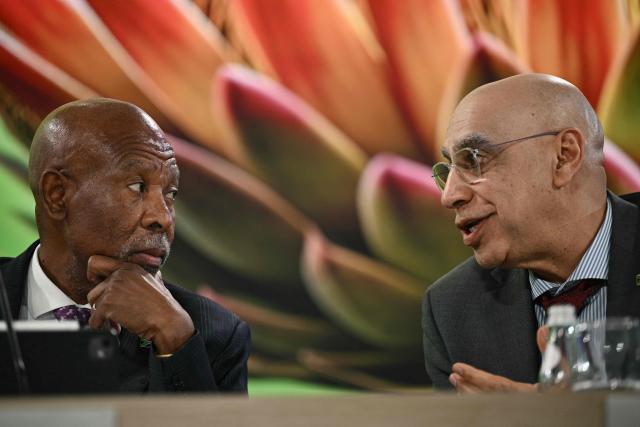 (L-R) Lesetja Kganyago, governor of South Africa's Reserve Bank (SARB) and deputy governor of the South African Reserve Bank, Dr Rashad Cassim speak at a G-20 briefing during the IMF/World Bank annual meetings at the IMF headquarters in Washington, DC, on October 16, 2025. (Photo by Brendan SMIALOWSKI / AFP)