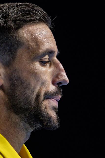 Bosnia Herzegovina's Damir Dzumhur reacst as he plays against Canada's Felix Auger-Aliassime during their men's single match of the European Open ATP tennis tournament in Brussels, on October 16, 2025. (Photo by DAVID PINTENS / Belga / AFP) / Belgium OUT