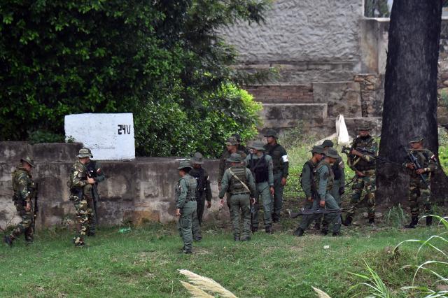 Venezuelan military patrol around the Simon Bolivar International Bridge at the Colombia-Venezuela border as seen from Villa del Rosario, Colombia on October 16, 2025. Following statements by the United States regarding possible ground operations with CIA support, the Venezuelan government deployed military forces to the border area around the Simon Bolívar International Bridge between San Antonio and Villa del Rosario. Heavily armed troops from the Bolivarian Army and Bolivarian National Guard are stationed in the area, guarding the border crossing in response to what Caracas considers a threat. (Photo by Schneyder Mendoza / AFP)