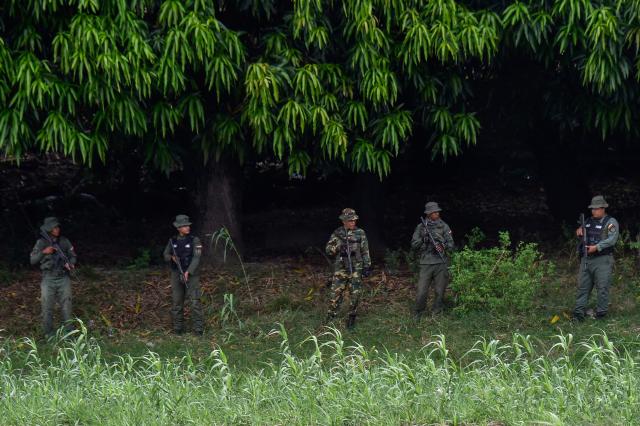 Venezuelan military patrol around the Simon Bolivar International Bridge at the Colombia-Venezuela border as seen from Villa del Rosario, Colombia on October 16, 2025. Following statements by the United States regarding possible ground operations with CIA support, the Venezuelan government deployed military forces to the border area around the Simon Bolívar International Bridge between San Antonio and Villa del Rosario. Heavily armed troops from the Bolivarian Army and Bolivarian National Guard are stationed in the area, guarding the border crossing in response to what Caracas considers a threat. (Photo by Schneyder Mendoza / AFP)