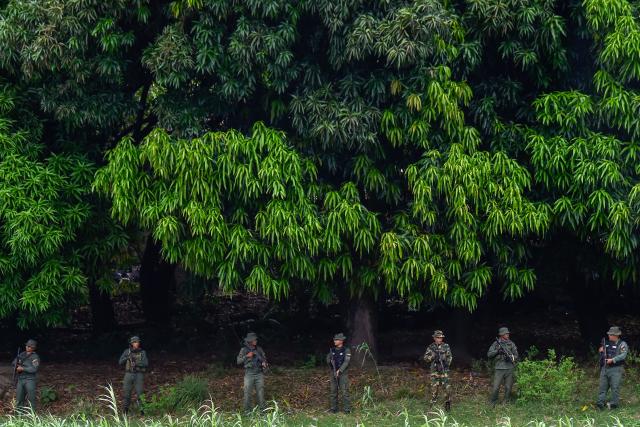 Venezuelan military patrol around the Simon Bolivar International Bridge at the Colombia-Venezuela border as seen from Villa del Rosario, Colombia on October 16, 2025. Following statements by the United States regarding possible ground operations with CIA support, the Venezuelan government deployed military forces to the border area around the Simon Bolívar International Bridge between San Antonio and Villa del Rosario. Heavily armed troops from the Bolivarian Army and Bolivarian National Guard are stationed in the area, guarding the border crossing in response to what Caracas considers a threat. (Photo by Schneyder Mendoza / AFP)