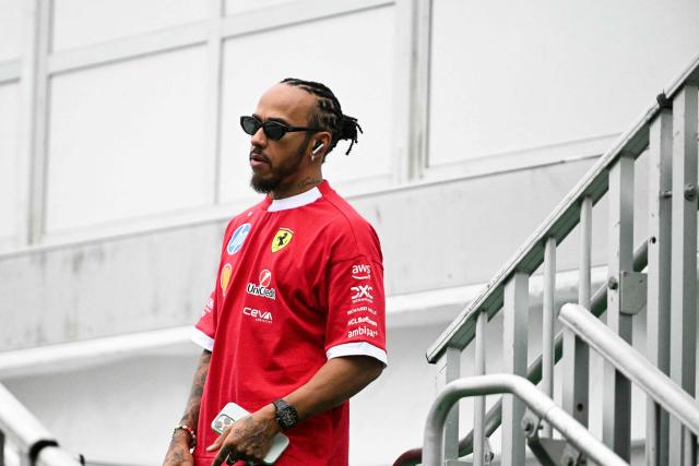Ferrari's British driver Lewis Hamilton arrives in the paddock ahead of the United States Formula One Grand Prix at the Circuit of the Americas in Austin, Texas, on October 16, 2025. (Photo by Jim WATSON / AFP)