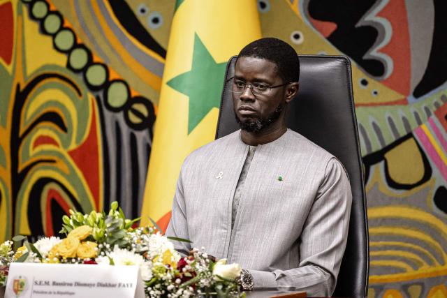 Senegal President Bassirou Diomaye Faye attends a ceremony after receiving the official report on the Thiaroye massacre, at the Presidential Palace in Dakar, on October 16, 2025. An official report commissioned by Senegal on the killing of dozens of African WWII troops by French forces in 1944 was presented to President Bassirou Diomaye Faye on October 16, 2025. The violent incident at the Thiaroye military camp just outside Dakar occurred after African soldiers who had fought for France during the war protested against pay delays. (Photo by PATRICK MEINHARDT / AFP)