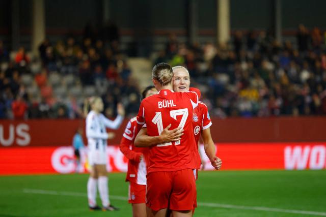 Bayern Munich's Danish forward #21 Pernille Harder (R) celebrates with Bayern Munich's German forward #17 Klara Buhl after scoring the opening 1-0 goal during the UEFA Women's Champions League, league phase football match between FC Bayern Munich and Juventus in Munich, southern Germany, on October 16, 2025. (Photo by Michaela STACHE / AFP)