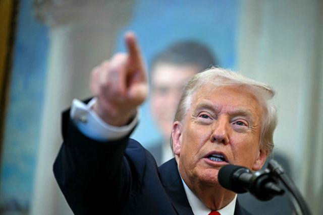 US President Donald Trump makes an announcement in the Oval Office of the White House in Washington, DC, on October 16, 2025. (Photo by ANDREW CABALLERO-REYNOLDS / AFP)