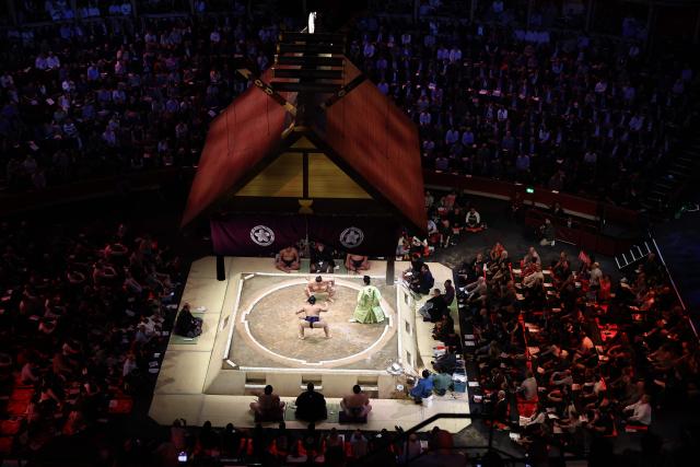 Hiradoumi faces Atamifuji during their bout on day 2 of the Grand Sumo Tournament at the Royal Albert Hall in central London on October 16, 2025. (Photo by HENRY NICHOLLS / AFP)