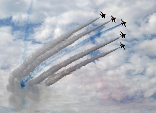 The Black Eagles, the aerobatic team of T-50 jets belonging to South Korea's Air Force, fly in formation during the Seoul International Aerospace and Defence Exhibition (ADEX) at a military airport in Seongnam on October 17, 2025. (Photo by Jung Yeon-je / AFP)