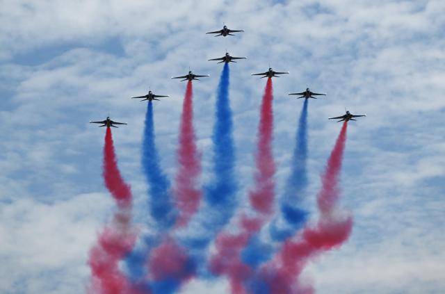 The Black Eagles, the aerobatic team of T-50 jets belonging to South Korea's Air Force, fly in formation during the Seoul International Aerospace and Defence Exhibition (ADEX) at a military airport in Seongnam on October 17, 2025. (Photo by Jung Yeon-je / AFP)