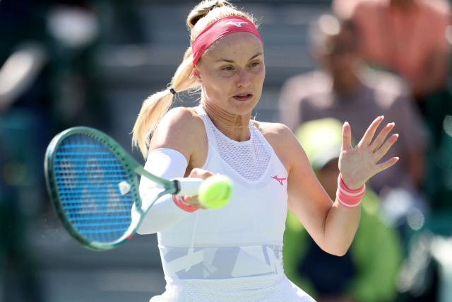 Slovakia's Rebecca Sramkova hits a return to Canada's Leylah Fernandez during their women's singles quarter-final match at the Japan Open tennis tournament in Osaka on October 17, 2025. (Photo by PAUL MILLER / AFP)