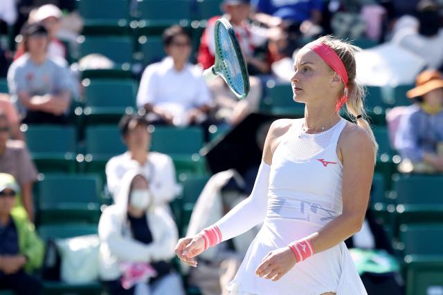 Slovakia's Rebecca Sramkova throws her racquet after losing a point against Canada's Leylah Fernandez during their women's singles quarter-final match at the Japan Open tennis tournament in Osaka on October 17, 2025. (Photo by PAUL MILLER / AFP)