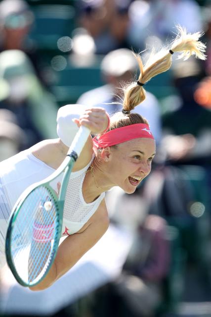 Slovakia's Rebecca Sramkova serves to Canada's Leylah Fernandez during their women's singles quarter-final match at the Japan Open tennis tournament in Osaka on October 17, 2025. (Photo by PAUL MILLER / AFP)