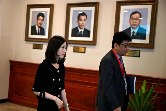 South Korea's Second Vice Foreign Minister Kim Jin-a (L) arrives for a meeting at the Ministry of Foreign Affairs and International Cooperation building in Phnom Penh on October 17, 2025. Two South Koreans detained in a crime crackdown by Cambodian authorities returned home on October 17, police said, a day after Phnom Penh announced plans to deport 59 Koreans accused of working in cyberscam operations. (Photo by TANG CHHIN Sothy / AFP)
