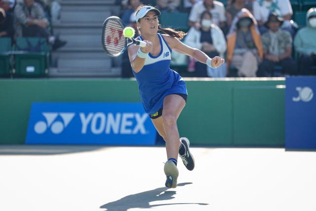 Romania's Sorana Cirstea hits a return to Switzerland's Viktorija Golubic during their women's quarter-final match at the Japan Open tennis tournament in Osaka on October 17, 2025. (Photo by PAUL MILLER / AFP)