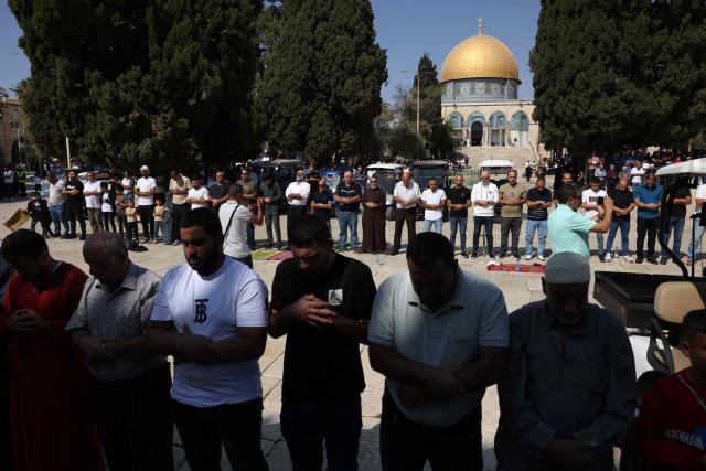 Muslim worshippers attend friday prayers in front of the Dome of the Rock mosque at the Al-Aqsa mosque compound in Jerusalem's Old City on October 17, 2025. (Photo by AHMAD GHARABLI / AFP)