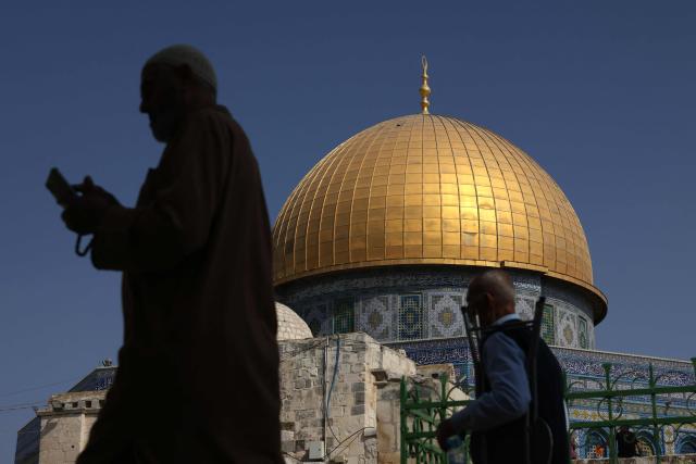 Muslim worshippers walk next to the Dome of the Rock mosque at the Al-Aqsa mosque compound in Jerusalem's Old City on October 17, 2025. (Photo by AHMAD GHARABLI / AFP)