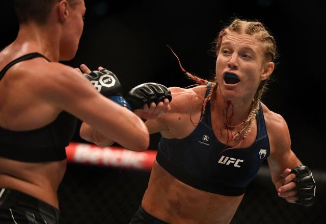 (FILES) French mixed martial arts fighter Manon Fiorot (R) fights against US mixed martial arts fighter Rose Namajunas (L) on the octogone during their UFC Lightweight bout at The Accor Arena in Paris, on September 2, 2023. Five months after missing her chance to capture the UFC flyweight belt, MMA fighter Manon Fiorot returns to the fight against Canadian Jasmine Jasudavicius on October 18, 2025 in Vancouver (Canada), where she hopes to make a fresh start. (Photo by JULIEN DE ROSA / AFP)