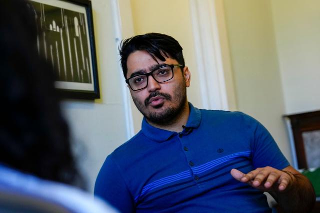 Former asylum seeker Mo Naeimi, a 29-year-old Iranian, poses for a photograph following an interview with AFP in London on September 8, 2025. (Photo by CARLOS JASSO / AFP) / TO GO WITH AFP STORY BY Akshata KAPOOR