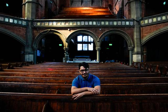 Former asylum seeker Mo Naeimi, a 29-year-old Iranian, poses for a photograph following an interview with AFP in London on September 8, 2025. (Photo by CARLOS JASSO / AFP) / TO GO WITH AFP STORY BY Akshata KAPOOR