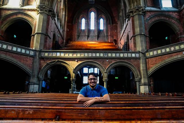 Former asylum seeker Mo Naeimi, a 29-year-old Iranian, poses for a photograph following an interview with AFP in London on September 8, 2025. (Photo by CARLOS JASSO / AFP) / TO GO WITH AFP STORY BY Akshata KAPOOR