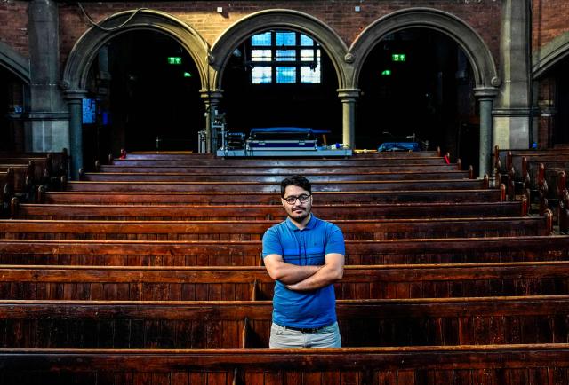 Former asylum seeker Mo Naeimi, a 29-year-old Iranian, poses for a photograph following an interview with AFP in London on September 8, 2025. (Photo by CARLOS JASSO / AFP) / TO GO WITH AFP STORY BY Akshata KAPOOR