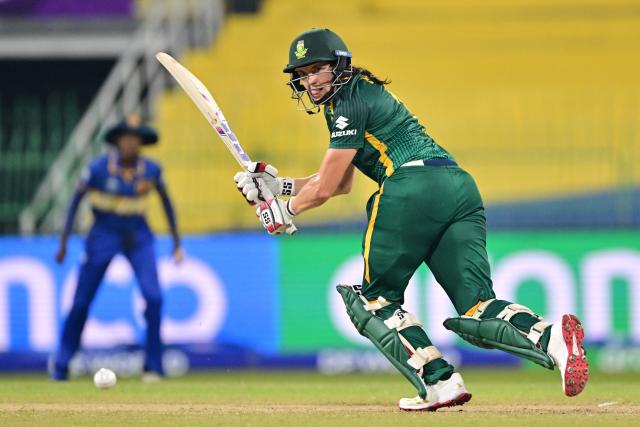 South Africa's Tazmin Brits (R) plays a shot during the ICC Women's Cricket World Cup 2025 one-day international (ODI) match between Sri Lanka and South Africa at the R. Premadasa International Cricket Stadium in Colombo on October 17, 2025. (Photo by Ishara S. KODIKARA / AFP)