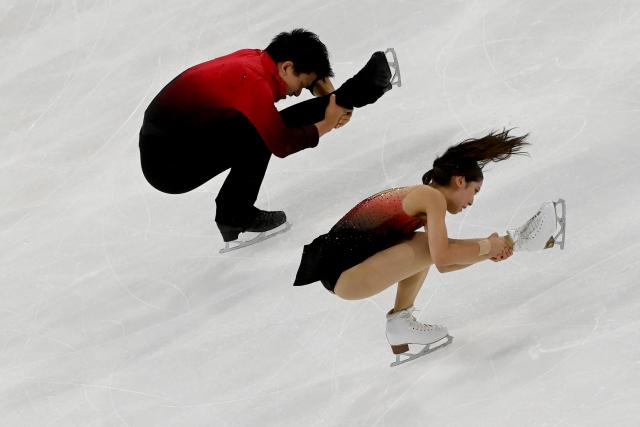 Japan’s Riku Miura and Ryuichi Kihara compete during the pairs' short program of the ISU 2025 figure skating French Grand Prix in Angers, western France, on October 17, 2025. (Photo by JEAN-FRANCOIS MONIER / AFP)