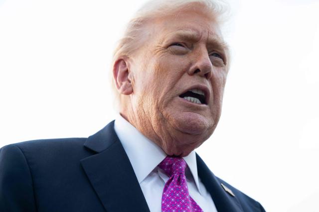 US President Donald Trump speaks to the press after disembarking from Air Force One upon arrival at Palm Beach International Airport in West Palm Beach, Florida, October 17, 2025, as he travels to Mar-a-Lago for the weekend. (Photo by SAUL LOEB / AFP)