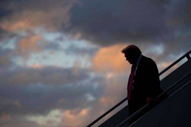 US President Donald Trump disembarks from Air Force One upon arrival at Palm Beach International Airport in West Palm Beach, Florida, October 17, 2025, as he travels to Mar-a-Lago for the weekend. (Photo by SAUL LOEB / AFP)