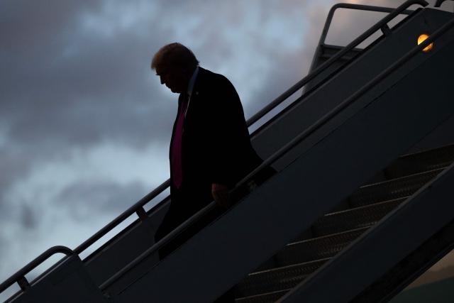 US President Donald Trump disembarks from Air Force One upon arrival at Palm Beach International Airport in West Palm Beach, Florida, October 17, 2025, as he travels to Mar-a-Lago for the weekend. (Photo by SAUL LOEB / AFP)