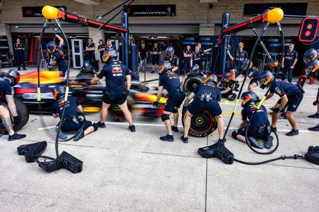 Red Bull technicians work on the car of Red Bull Racing's Dutch driver Max Verstappen in pit lane during the practice session for the United States Formula One Grand Prix at the Circuit of the Americas in Austin, Texas, on October 17, 2025. (Photo by Jim WATSON / AFP)
