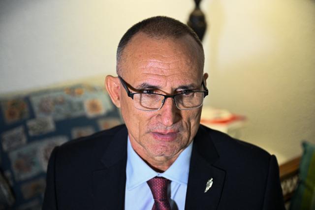 Cuban dissident Jose Daniel Ferrer speaks during an interview with AFP in his house in Miami, Florida, on October 16, 2025. There's no rest for Jose Daniel Ferrer, a Cuban dissident who arrived in the United States on October 13 and is determined to work with other exiles to democratically unseat the communist government in Havana. "We have to be proactive if we want to encourage Cubans to fight for their rights, for their freedom, instead of leaving the country with a 'save yourself if you can' type of mentality," the longtime activist told AFP from his new home in Miami. (Photo by CHANDAN KHANNA / AFP)