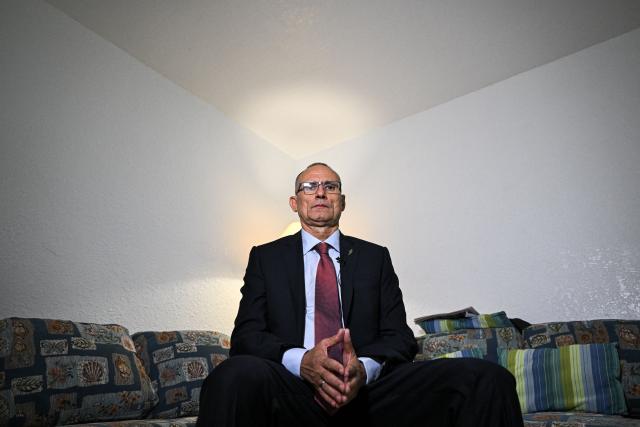 Cuban dissident Jose Daniel Ferrer poses during an interview with AFP in his house in Miami, Florida, on October 16, 2025. There's no rest for Jose Daniel Ferrer, a Cuban dissident who arrived in the United States on October 13 and is determined to work with other exiles to democratically unseat the communist government in Havana. "We have to be proactive if we want to encourage Cubans to fight for their rights, for their freedom, instead of leaving the country with a 'save yourself if you can' type of mentality," the longtime activist told AFP from his new home in Miami. (Photo by CHANDAN KHANNA / AFP)