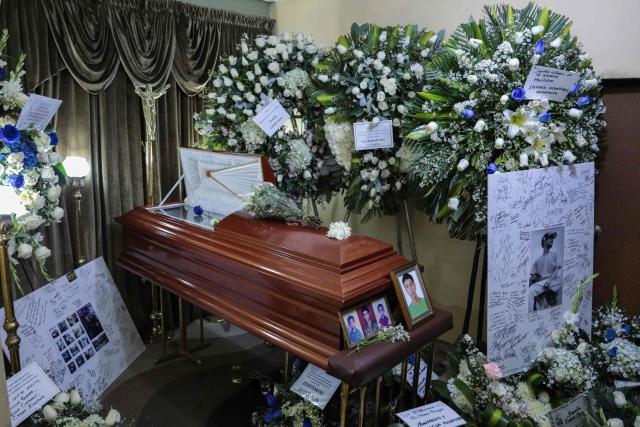 The coffin of Eduardo Ruiz, a demonstrator killed on October 15 during a protest against Peru's interim President Jose Jeri, is pictured during his wake in Lima on October 17, 2025. Peru's government on Friday suspended the police chief of the capital Lima after violent anti-government protests which left Ruiz dead and over 100 injured, according to a statement seen by AFP. (Photo by CONNIE FRANCE / AFP)