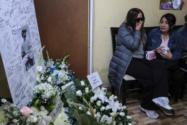 A woman cries during the wake of Eduardo Ruiz, a demonstrator killed on October 15 during a protest against Peru's interim President Jose Jeri, in Lima on October 17, 2025. Peru's government on Friday suspended the police chief of the capital Lima after violent anti-government protests which left Ruiz dead and over 100 injured, according to a statement seen by AFP. (Photo by CONNIE FRANCE / AFP)