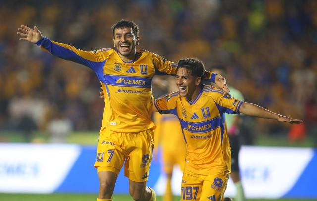 Tigres' Argentine forward (L) #07 Angel Correa celebrates after scoring his team's fourth goal with teammate forward #197 Diego Sanchez during the Liga MX Apertura tournament football match between Tigres and Necaxa at the University stadium -aka El Volcan- in San Nicolas de los Garza, Nuevo Leon, Mexico on October 17, 2025. (Photo by Julio Cesar AGUILAR / AFP)