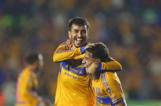 Tigres' Argentine forward (L) #07 Angel Correa celebrates after scoring his team's fourth goal with teammate forward #197 Diego Sanchez during the Liga MX Apertura tournament football match between Tigres and Necaxa at the University stadium -aka El Volcan- in San Nicolas de los Garza, Nuevo Leon, Mexico on October 17, 2025. (Photo by Julio Cesar AGUILAR / AFP)