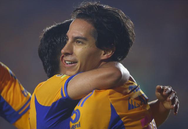 Tigres' midfielder #16 Diego Lainez celebrates after scoring his team's fifth goal with teammate forward #197 Diego Sanchez during the Liga MX Apertura tournament football match between Tigres and Necaxa at the University stadium -aka El Volcan- in San Nicolas de los Garza, Nuevo Leon, Mexico on October 17, 2025. (Photo by Julio Cesar AGUILAR / AFP)