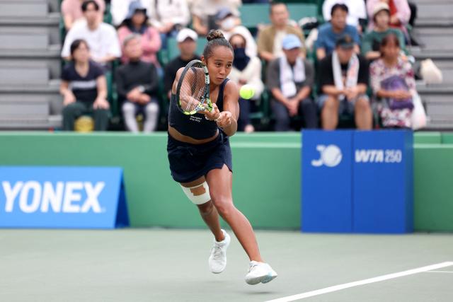 Canada's Leylah Fernandez hits a return to Romania's Sorana Cirstea during their women's singles semi-final match at the Japan Open tennis tournament in Osaka on October 18, 2025. (Photo by PAUL MILLER / AFP)