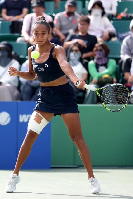Canada's Leylah Fernandez hits a return to Romania's Sorana Cirstea during their women's singles semi-final match at the Japan Open tennis tournament in Osaka on October 18, 2025. (Photo by PAUL MILLER / AFP)