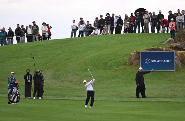 Nasa Hataoka of Japan plays a shot on the 9th hole during the third round of the LPGA Tour - BMW Ladies Championship golf tournament at Pine Beach Golf Links in Haenam on October 18, 2025. (Photo by Jung Yeon-je / AFP)